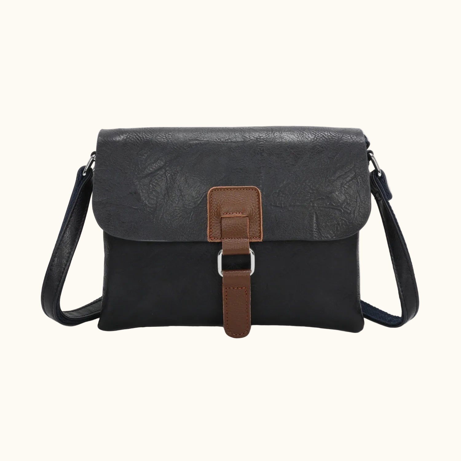 Black leather crossbody bag with brown strap on a white background