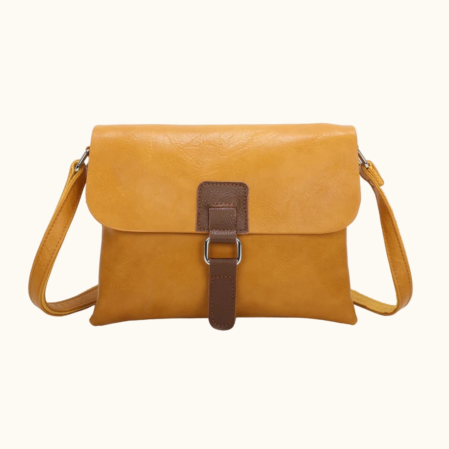 Brown leather handbag with a strap on a white background