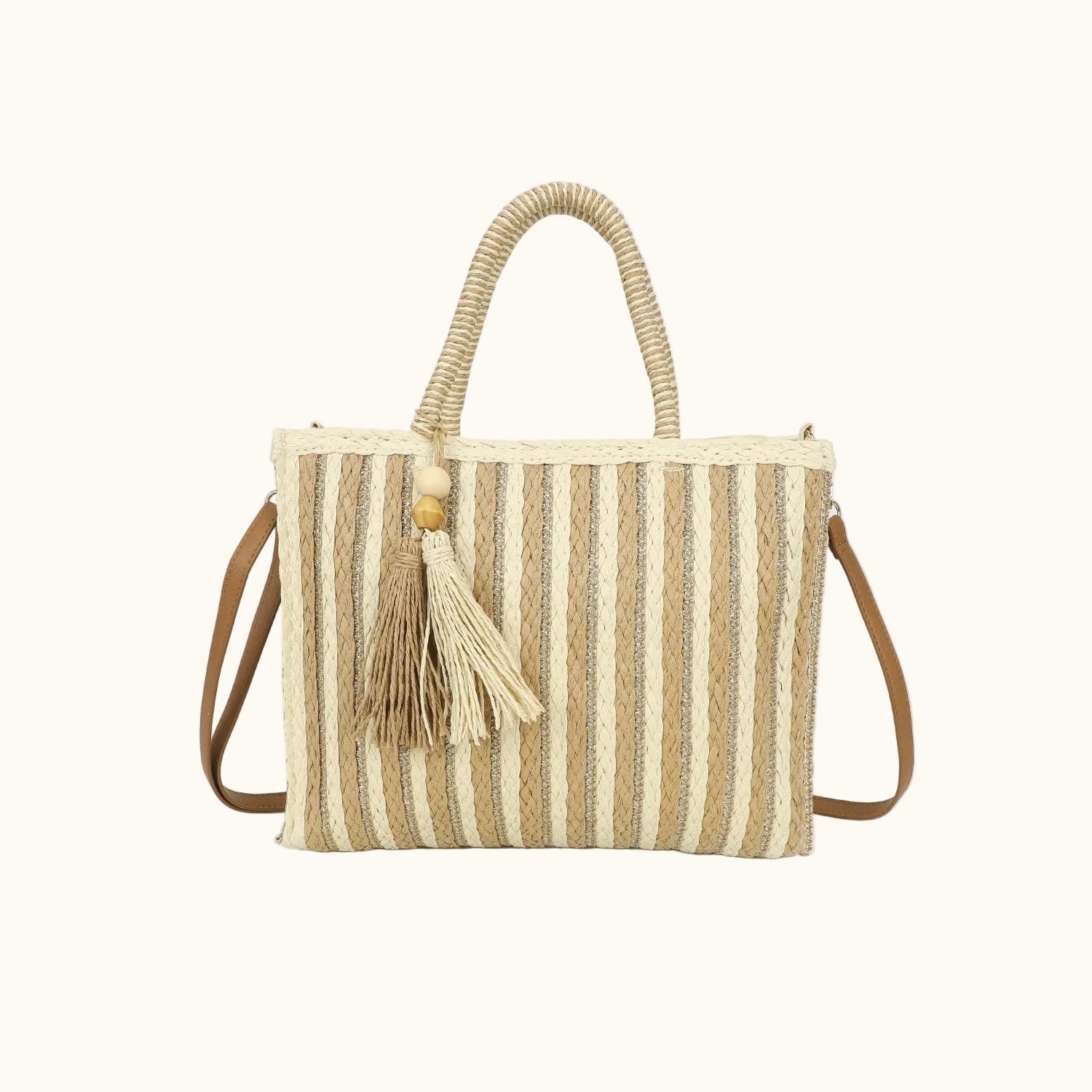 Striped straw handbag with tassel on a white background