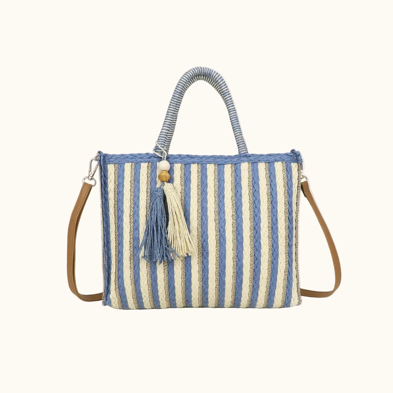 Striped handbag with tassel on a white background
