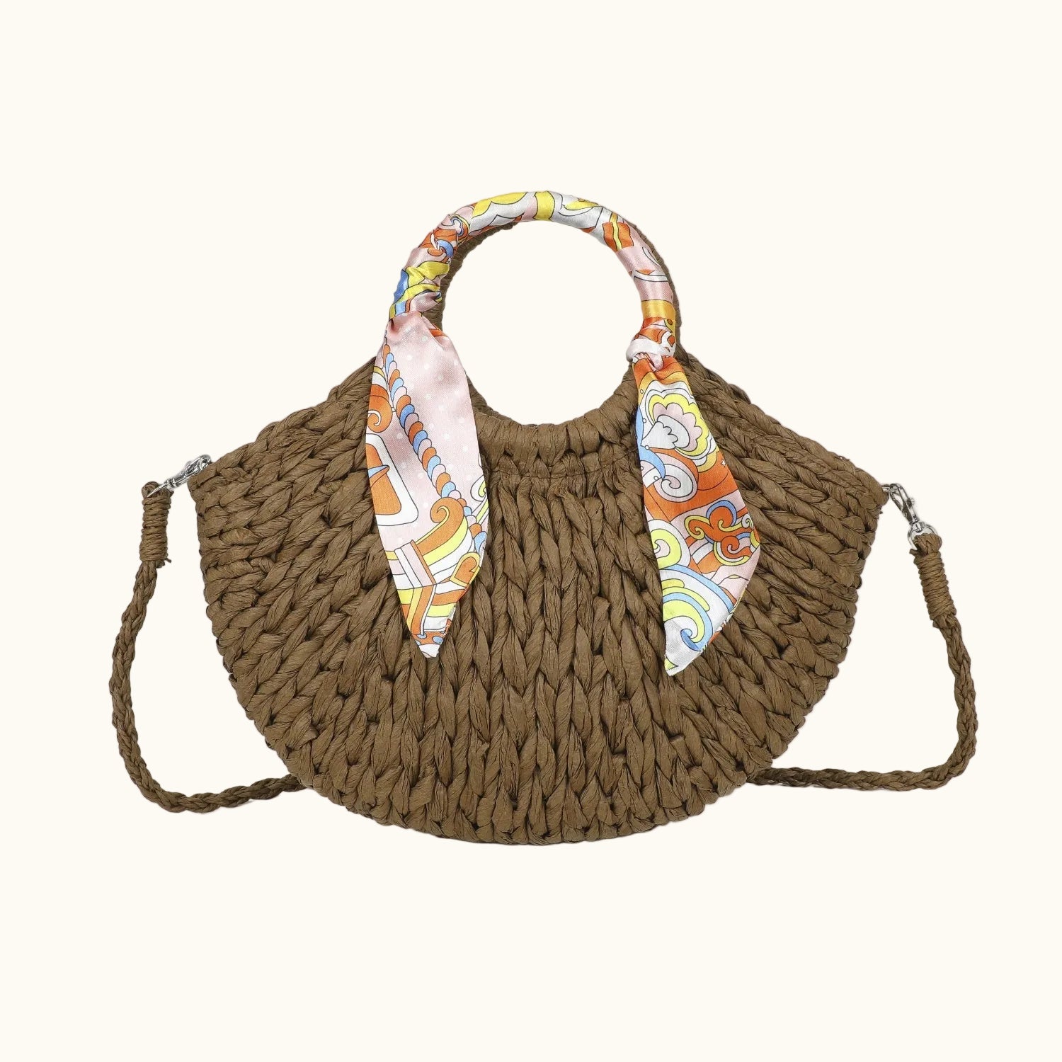 Brown woven handbag with a colorful scarf on a white background