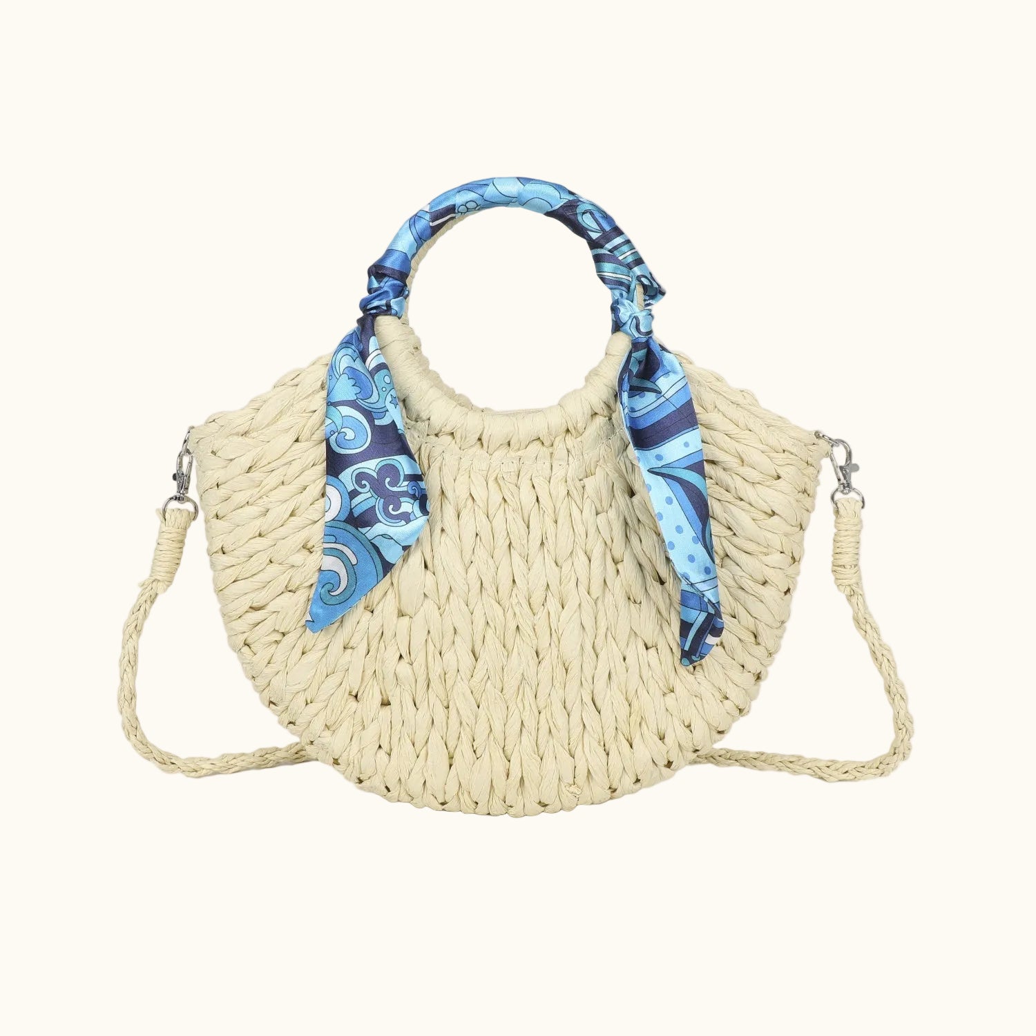 Woven handbag with a blue patterned handle on a white background