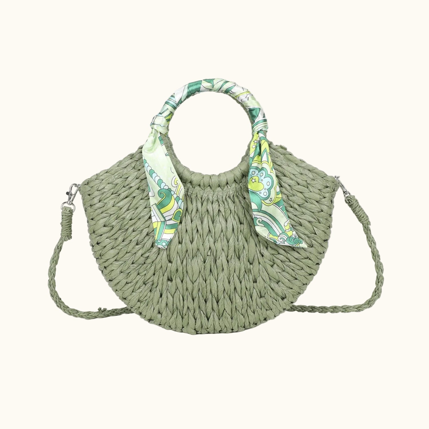 Green woven handbag with patterned handle on a white background