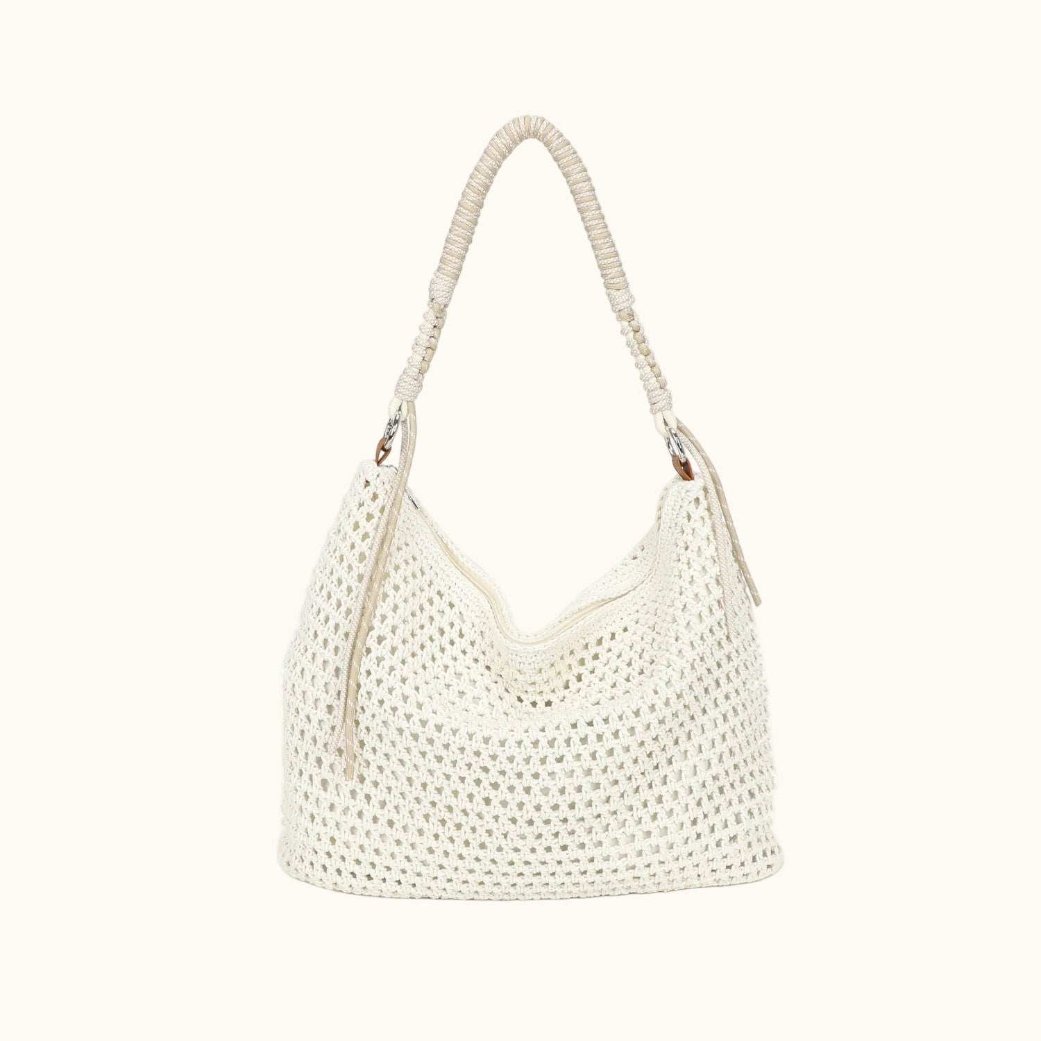 White woven handbag with a handle on a white background