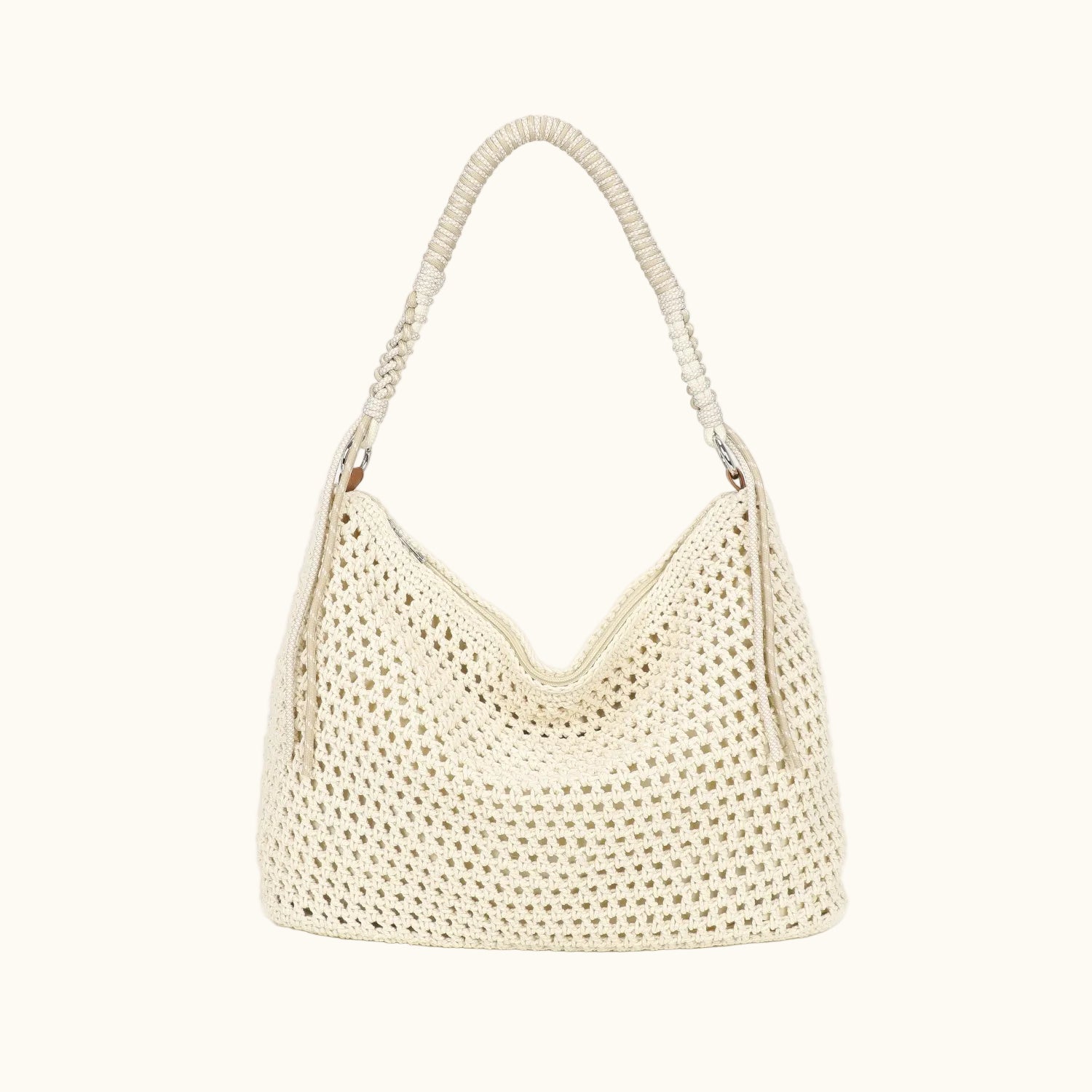 Beige woven handbag on a white background