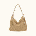 Beige woven handbag with a white handle on a white background