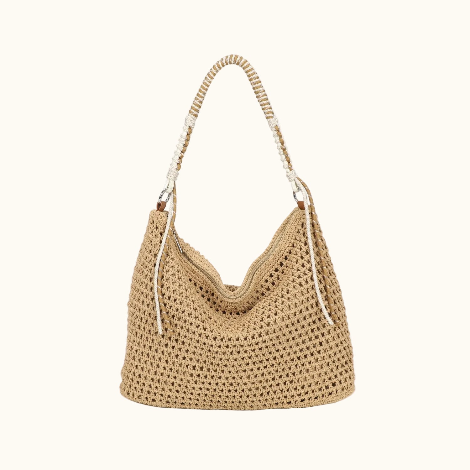 Beige woven handbag with a white handle on a white background