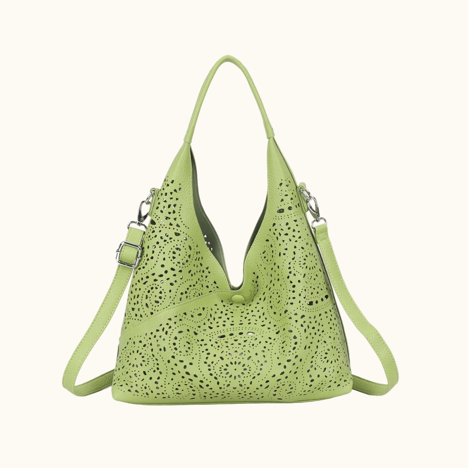 Green handbag with perforated design on a white background