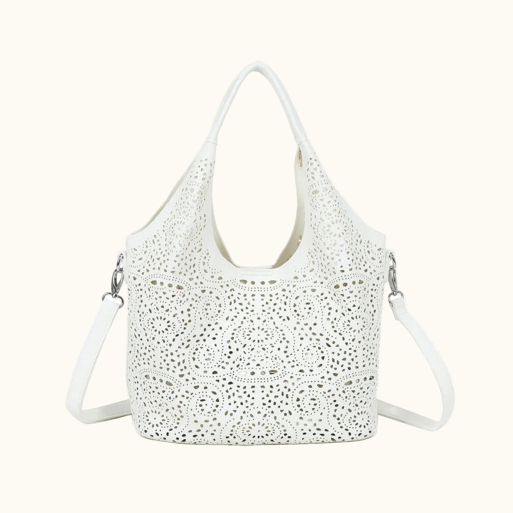 White handbag with cut-out design on a white background