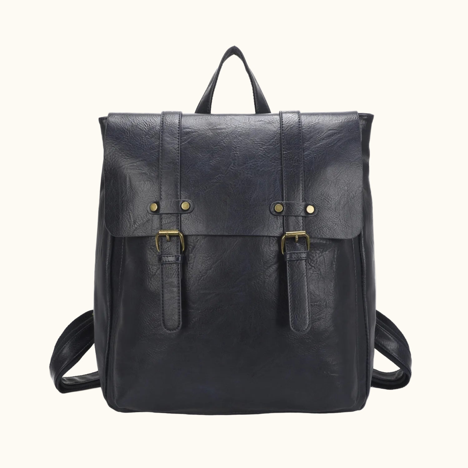 Black leather backpack with gold buckles on a white background