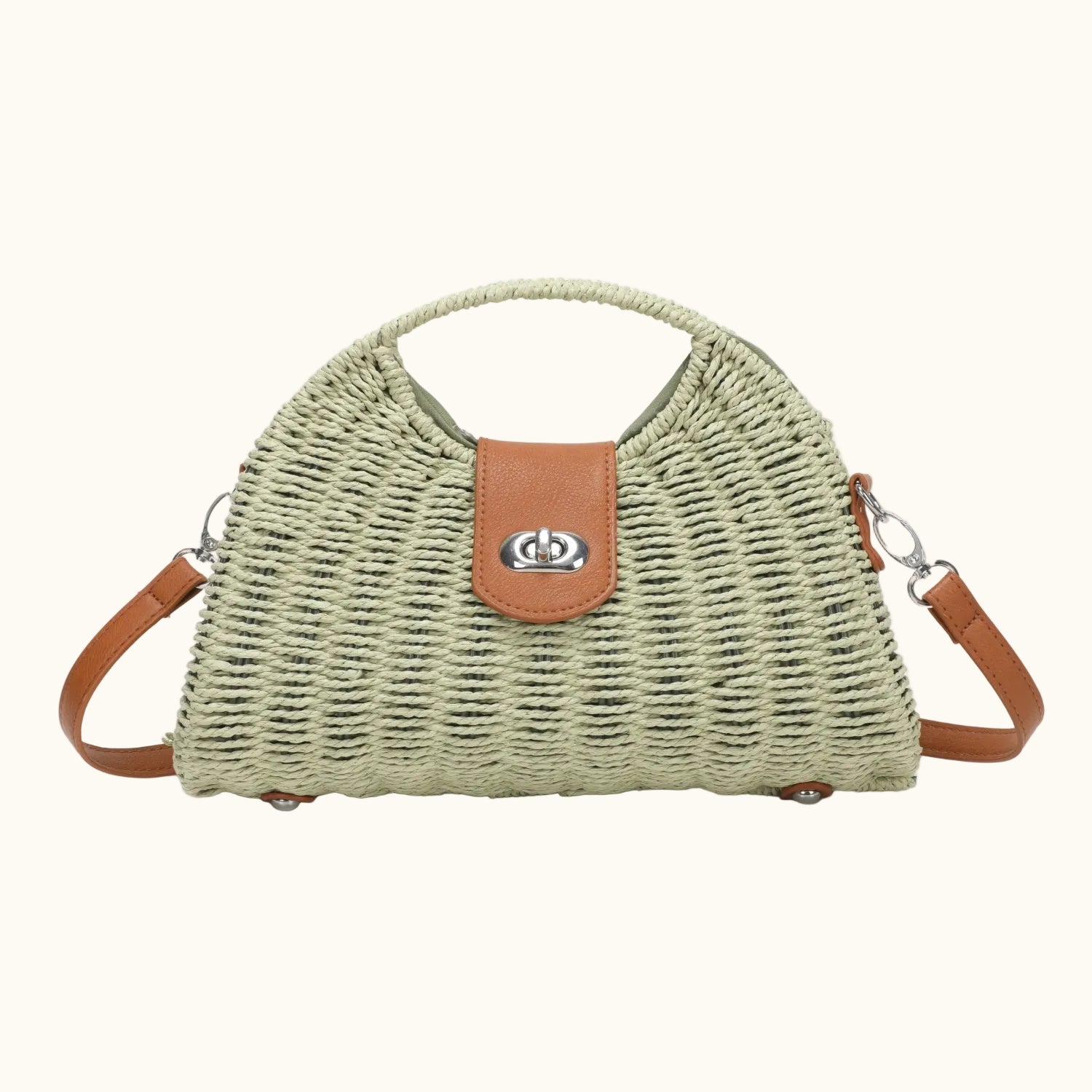 Green woven handbag with brown leather accents on a white background