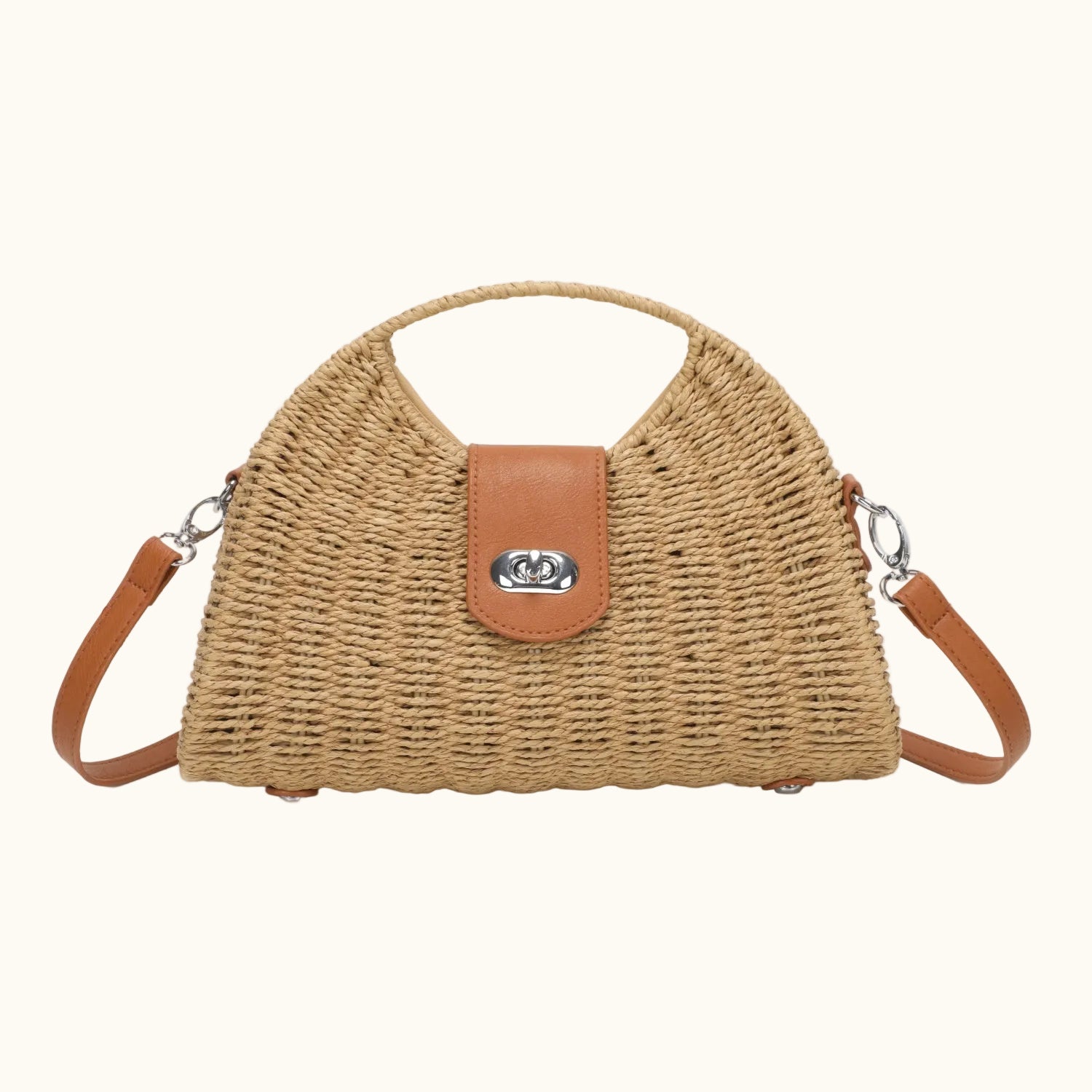 Woven handbag with brown leather accents on a white background