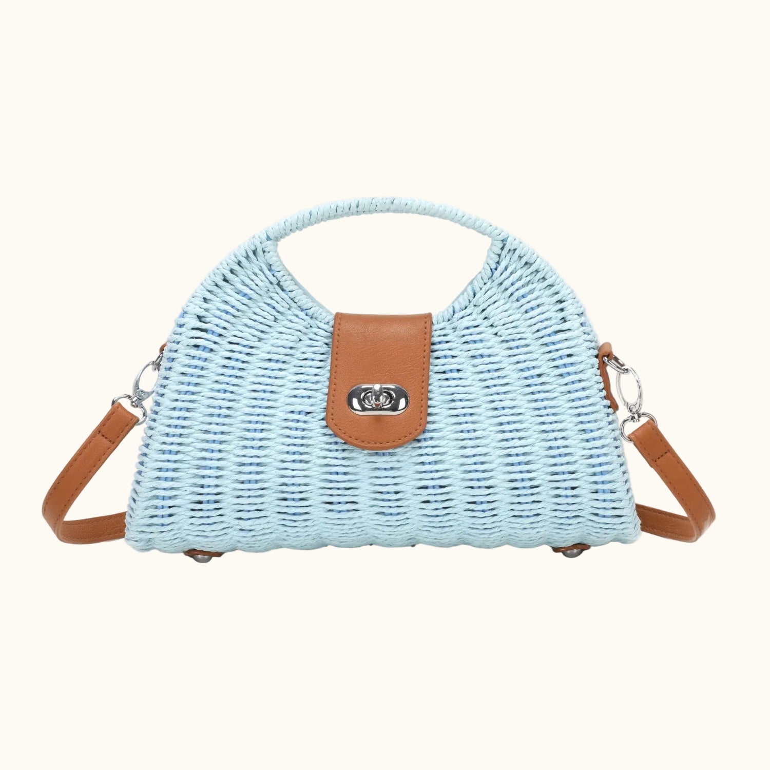 Light blue woven handbag with brown leather accents on a white background