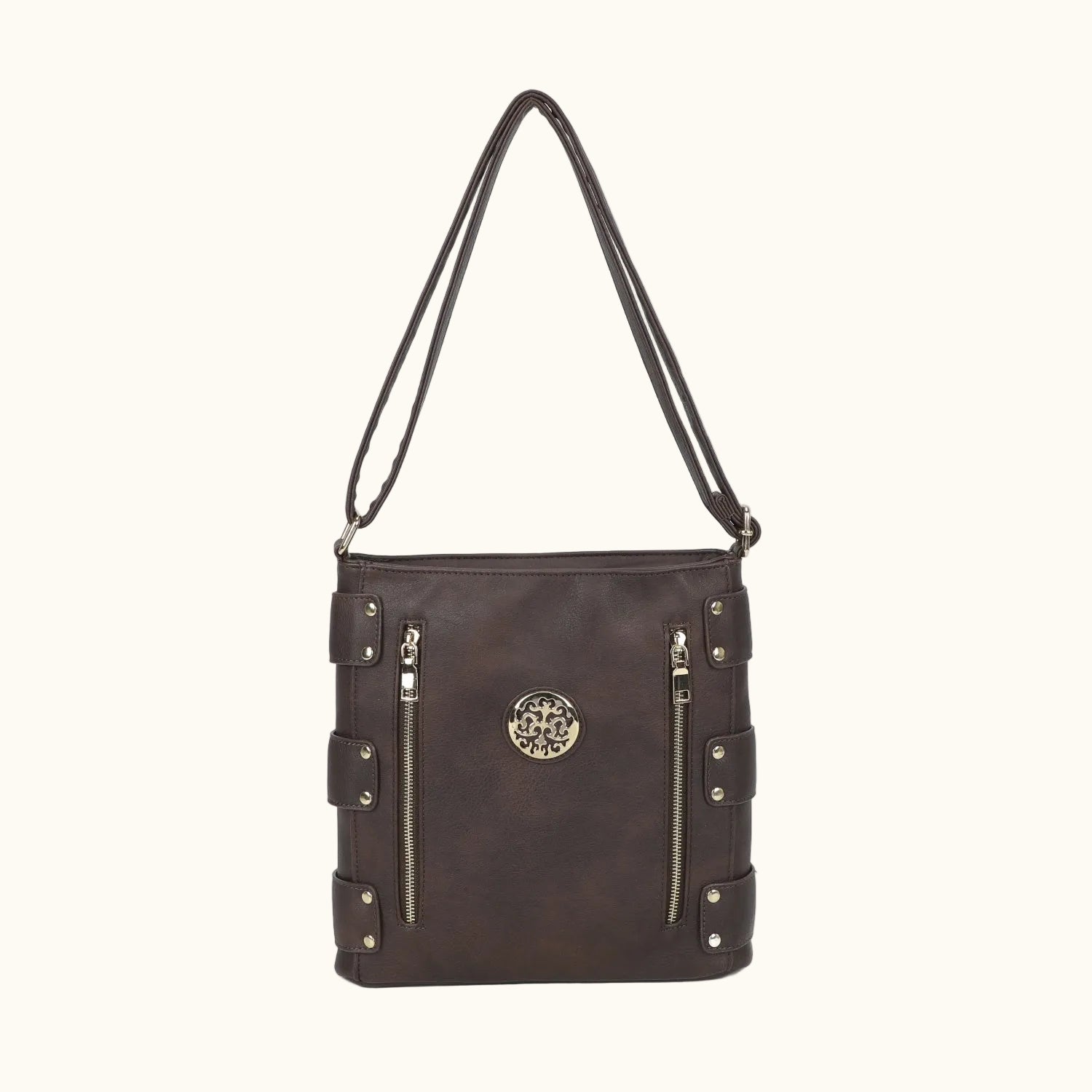 Brown shoulder bag with decorative elements on a white background
