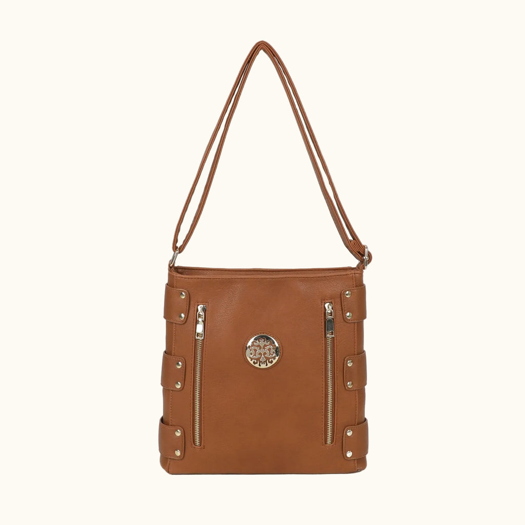 Brown leather handbag with gold accents on a white background