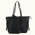 Black textured handbag with gold accents on a white background