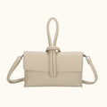 Beige handbag with a strap on a white background