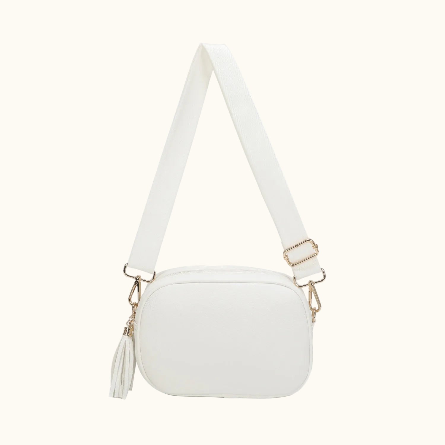 White crossbody bag with a strap on a white background
