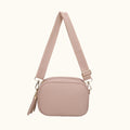 Beige crossbody bag with a strap on a white background