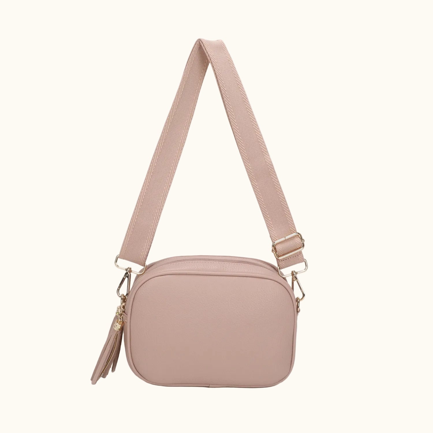Beige crossbody bag with a strap on a white background