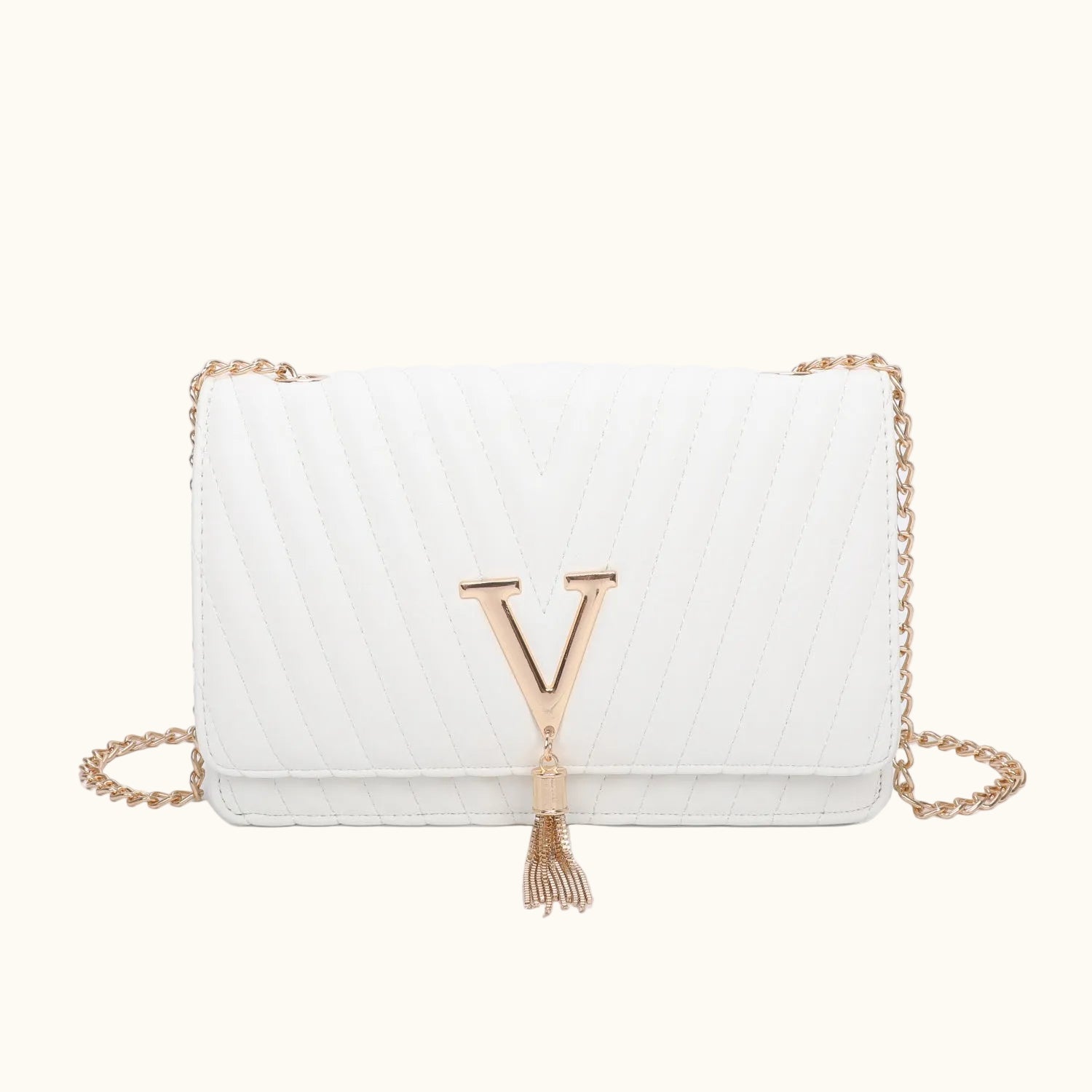 White handbag with a gold chain and letter 'Y' tassel on a white background