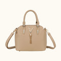 Beige handbag with a decorative clasp on a white background