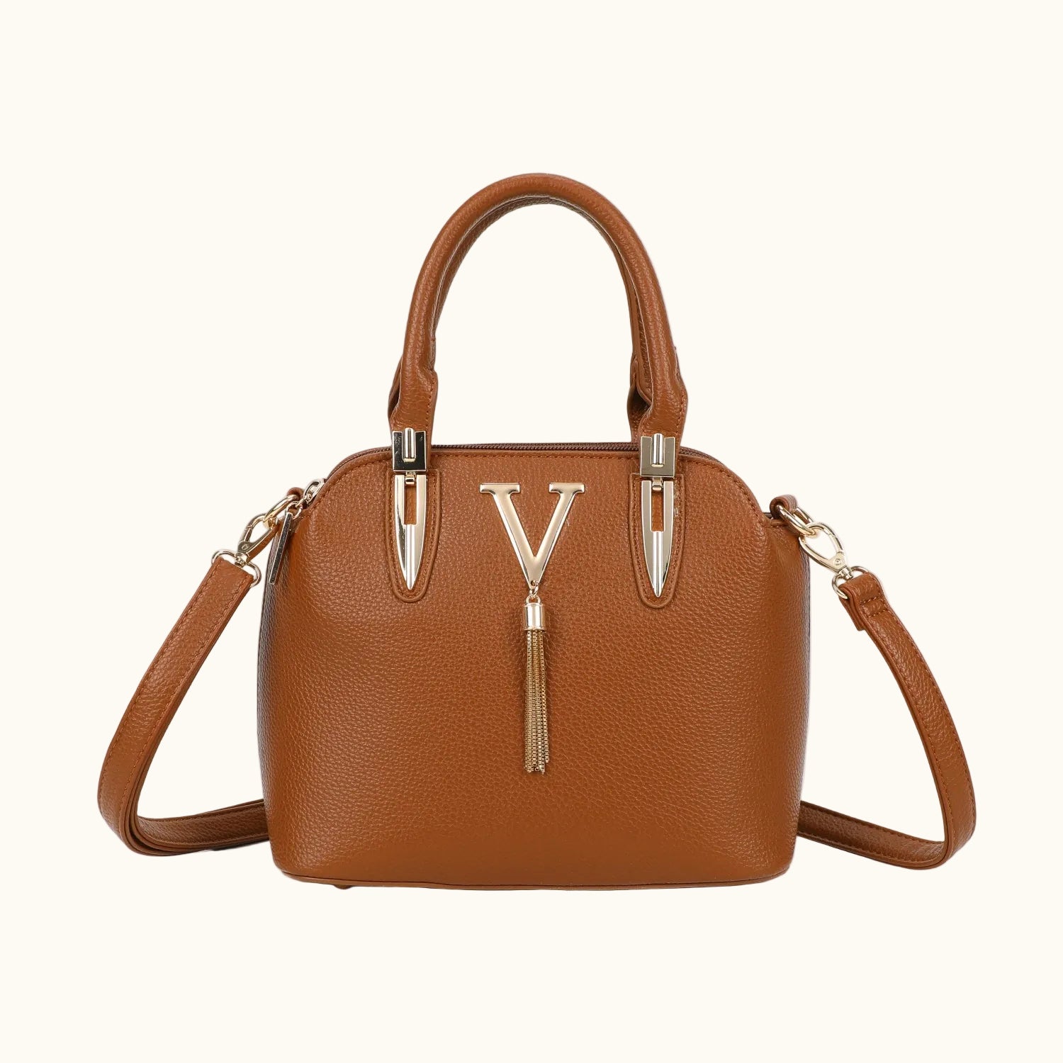 Brown handbag with a gold tassel on a white background