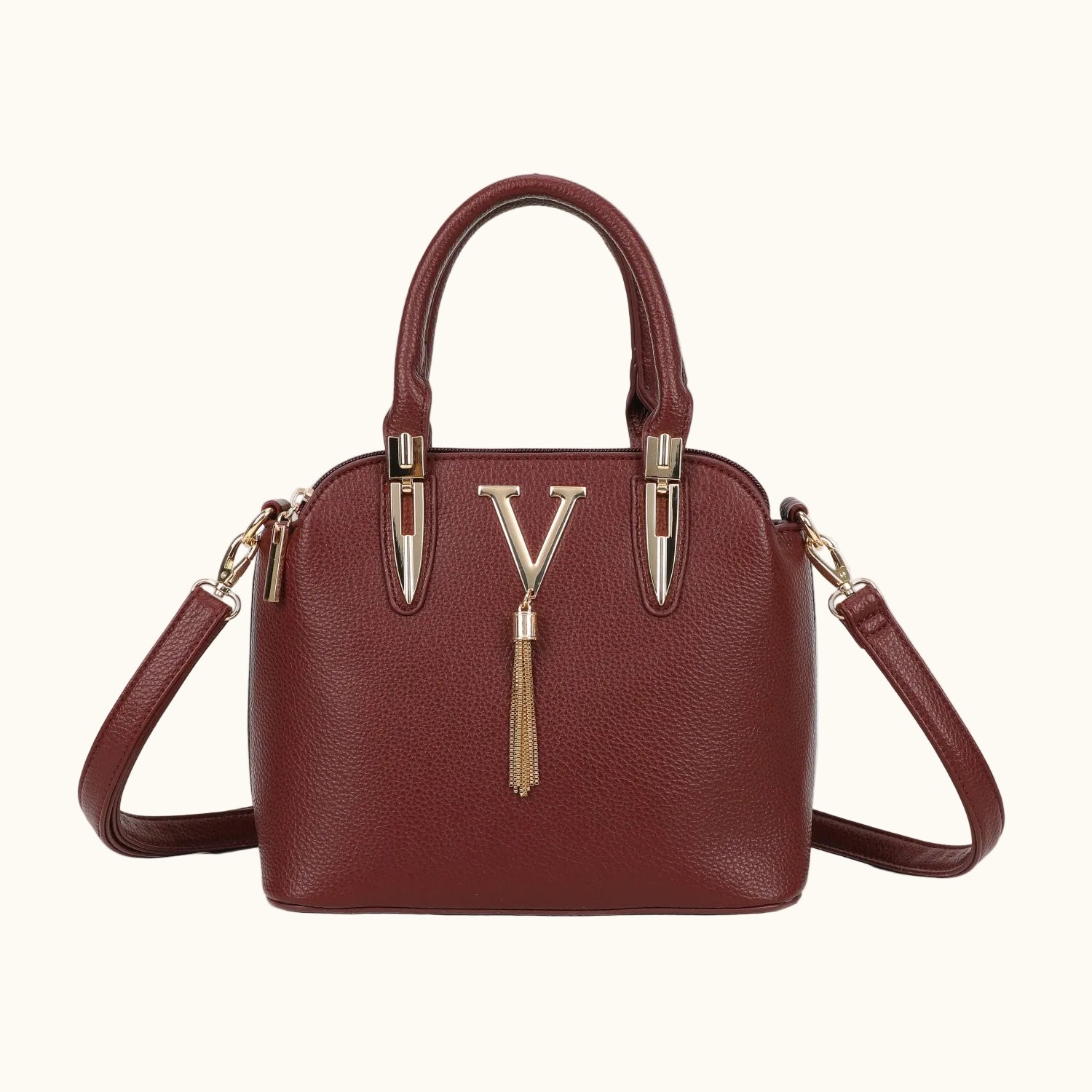Brown handbag with gold accents on a white background