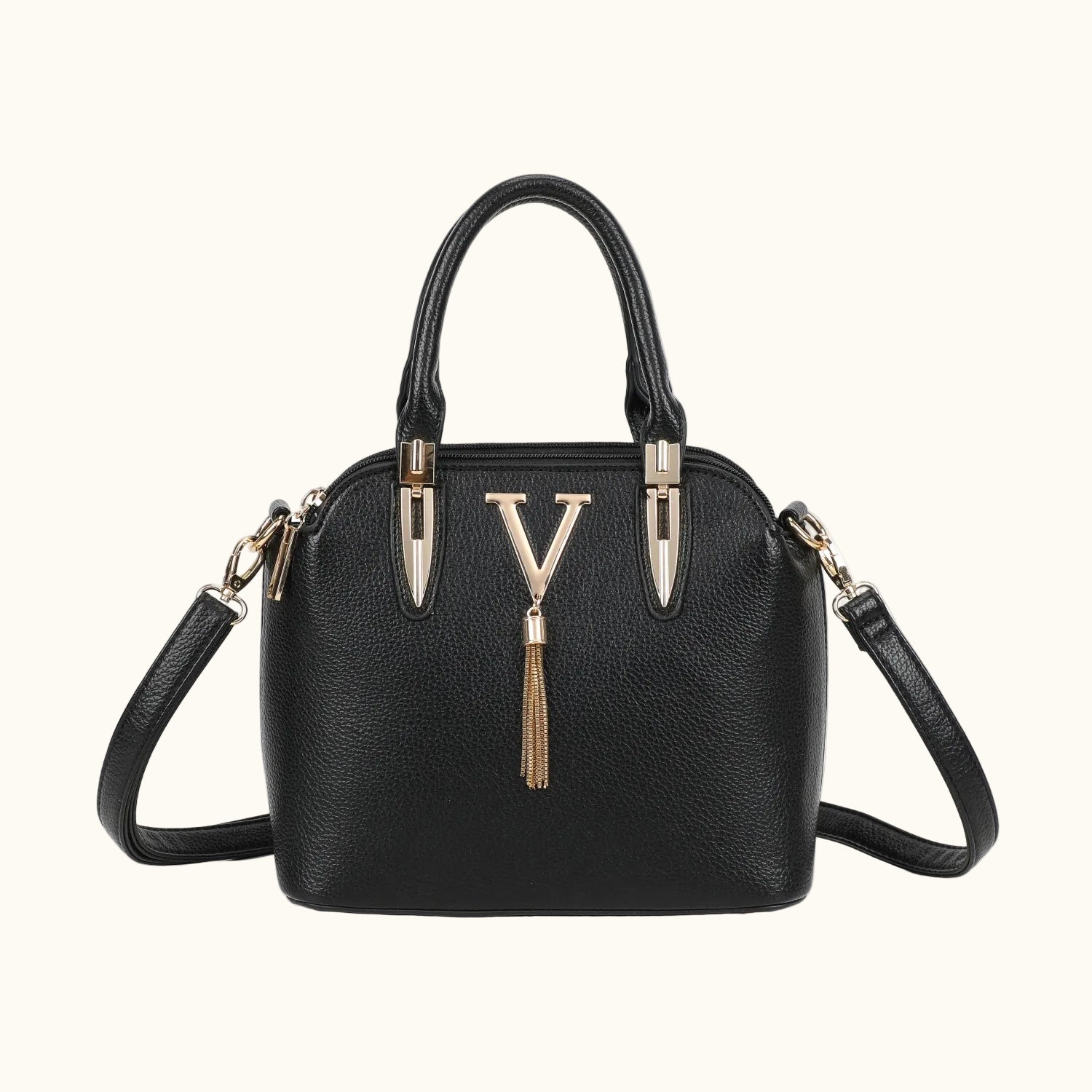 Black handbag with gold accents on a white background
