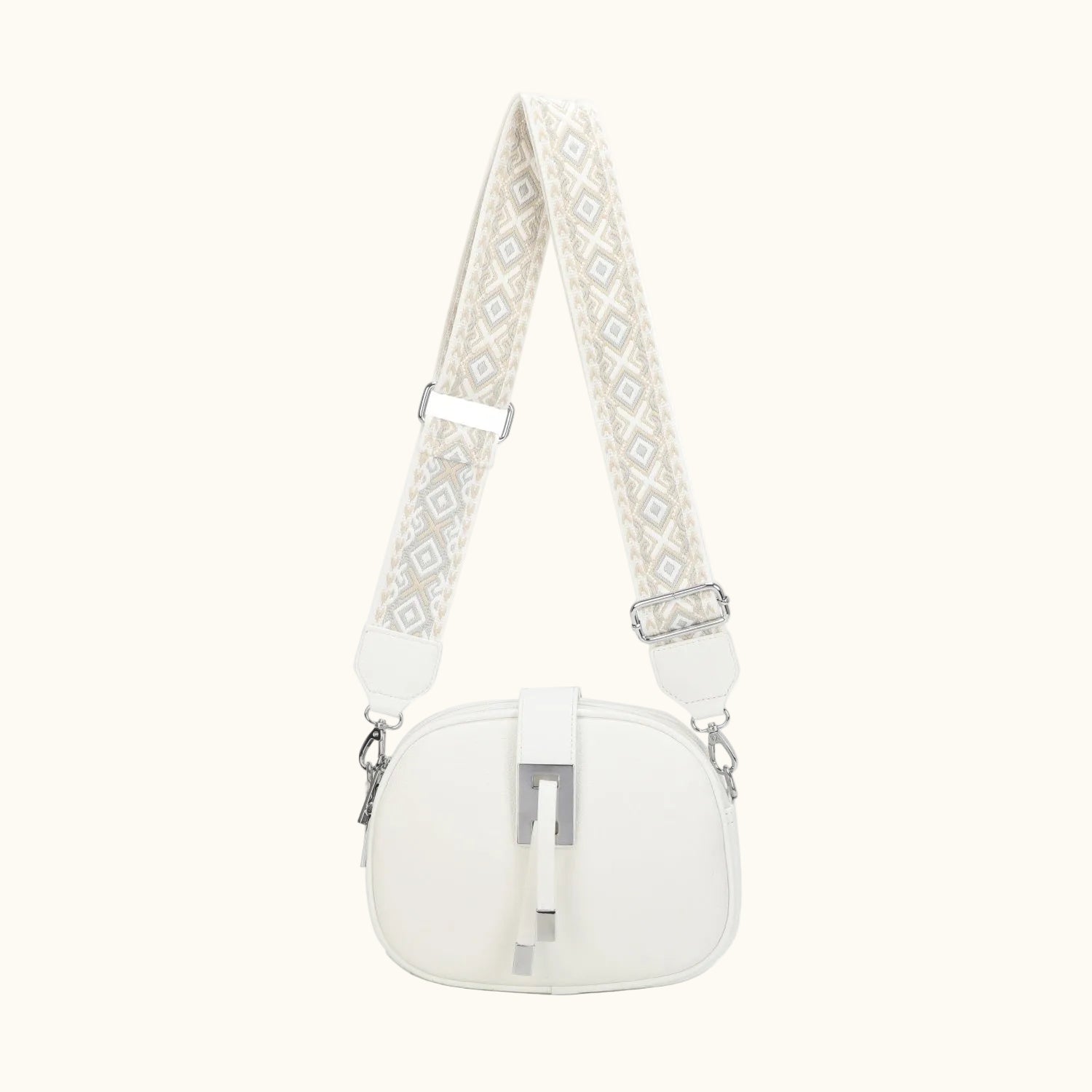 White handbag with a patterned strap on a white background