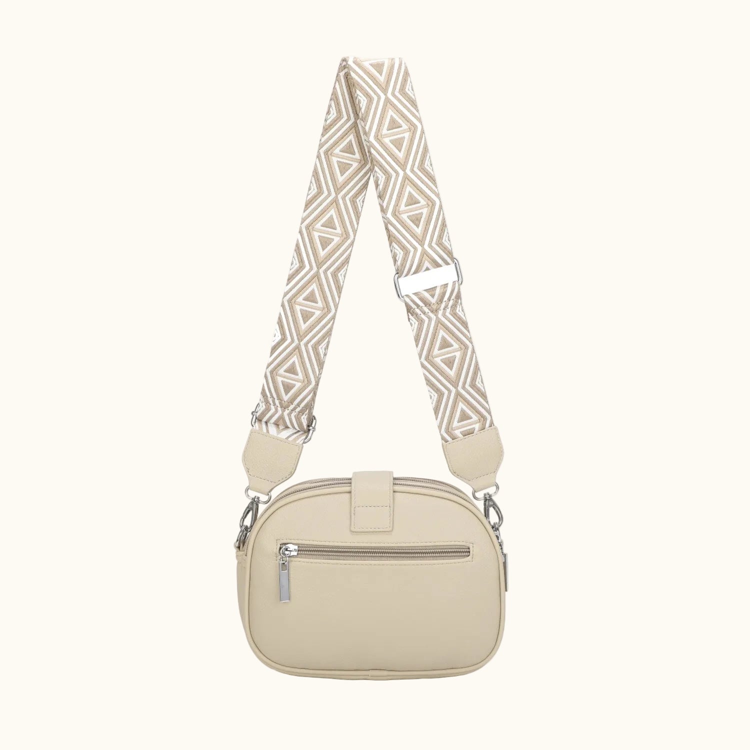 Beige handbag with a patterned strap on a white background