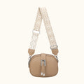 Beige handbag with a patterned strap on a white background