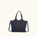 Navy quilted handbag with a gold logo on a white background