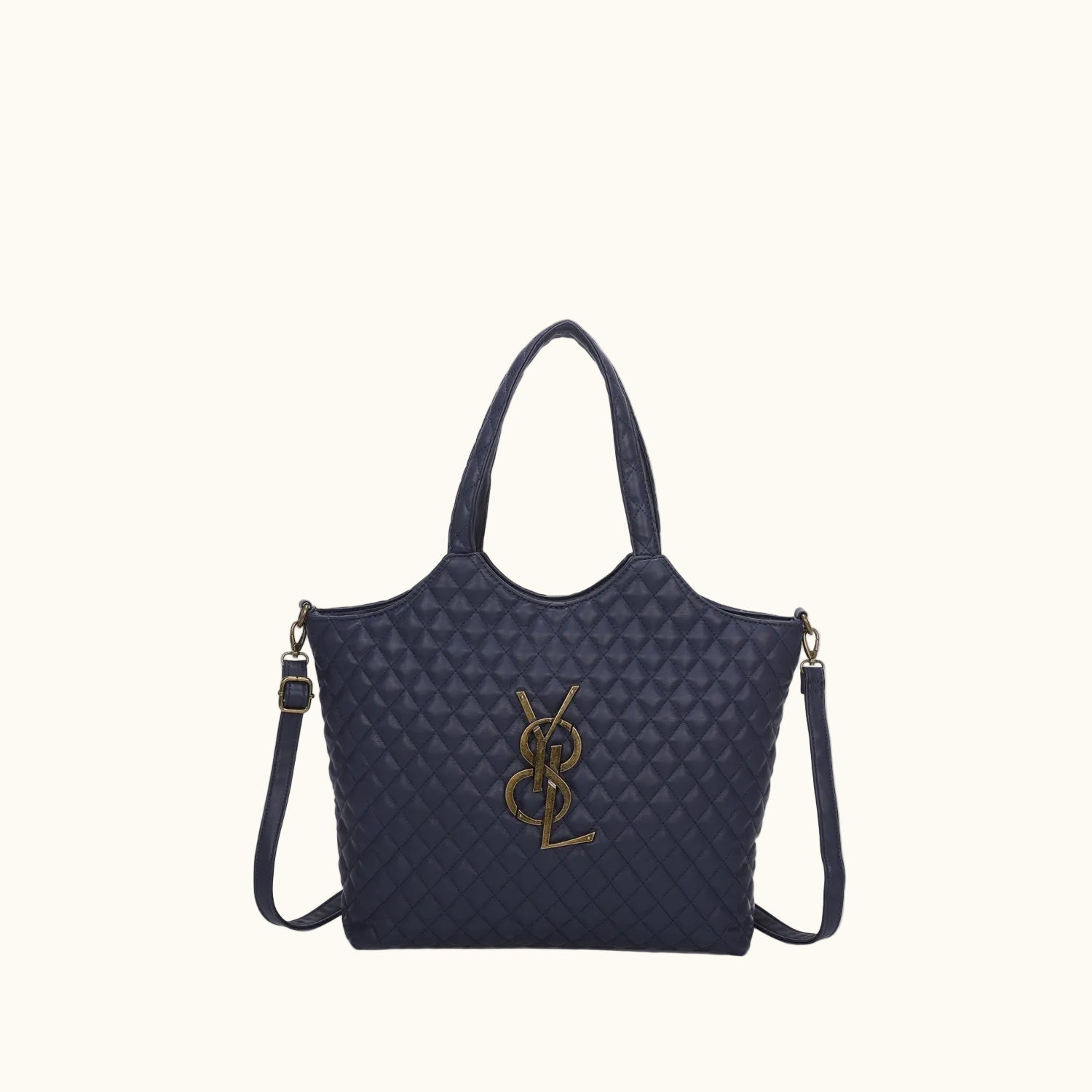 Navy quilted handbag with a gold logo on a white background