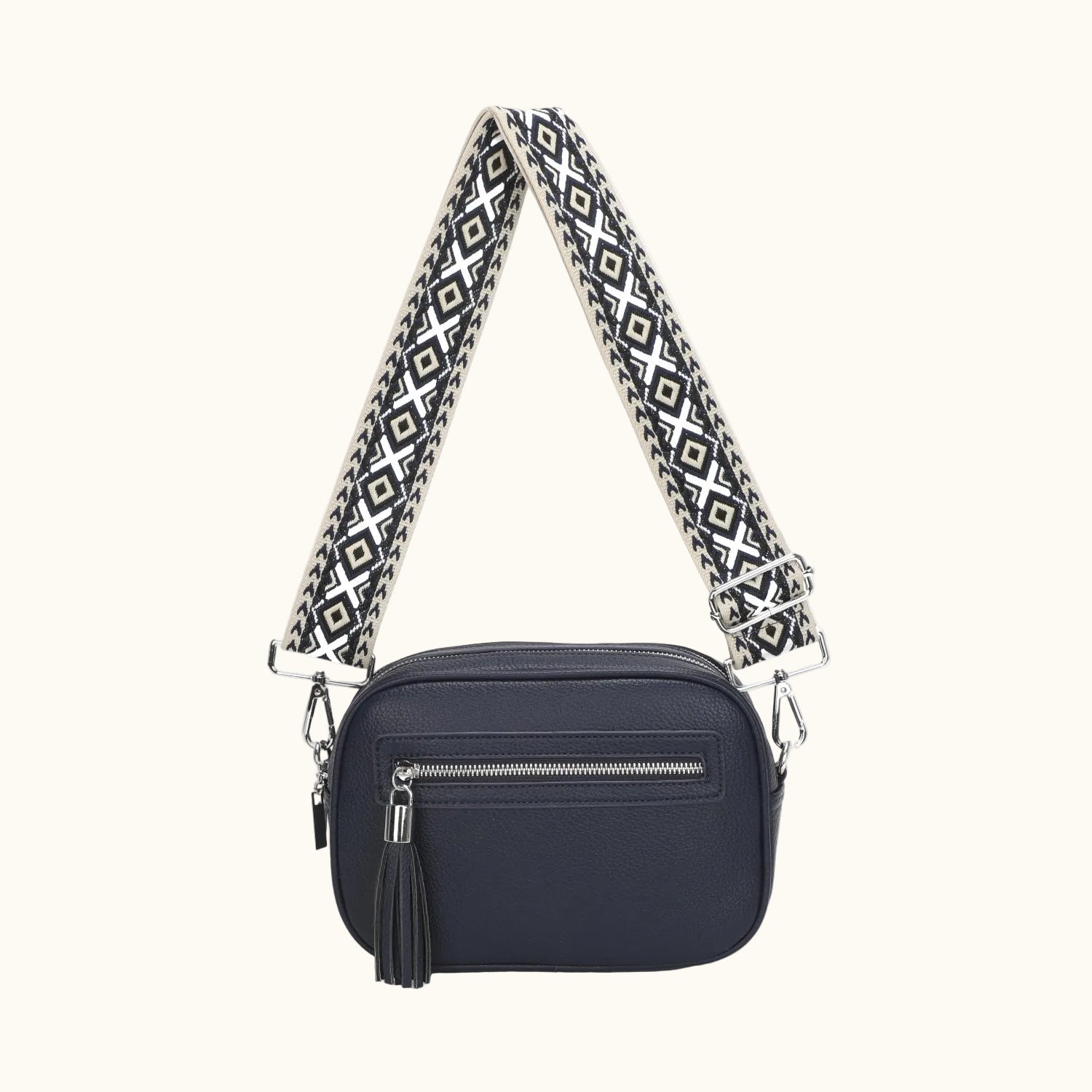 Navy blue handbag with a patterned strap on a white background