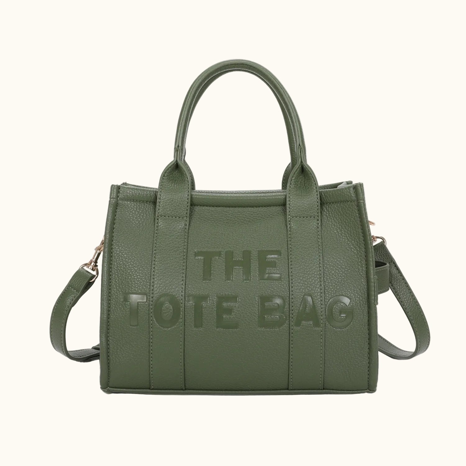 Green tote bag with 'THE TOTE BAG' text on a white background