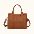 Brown tote bag with 'THE TOTE BAG' text on a white background