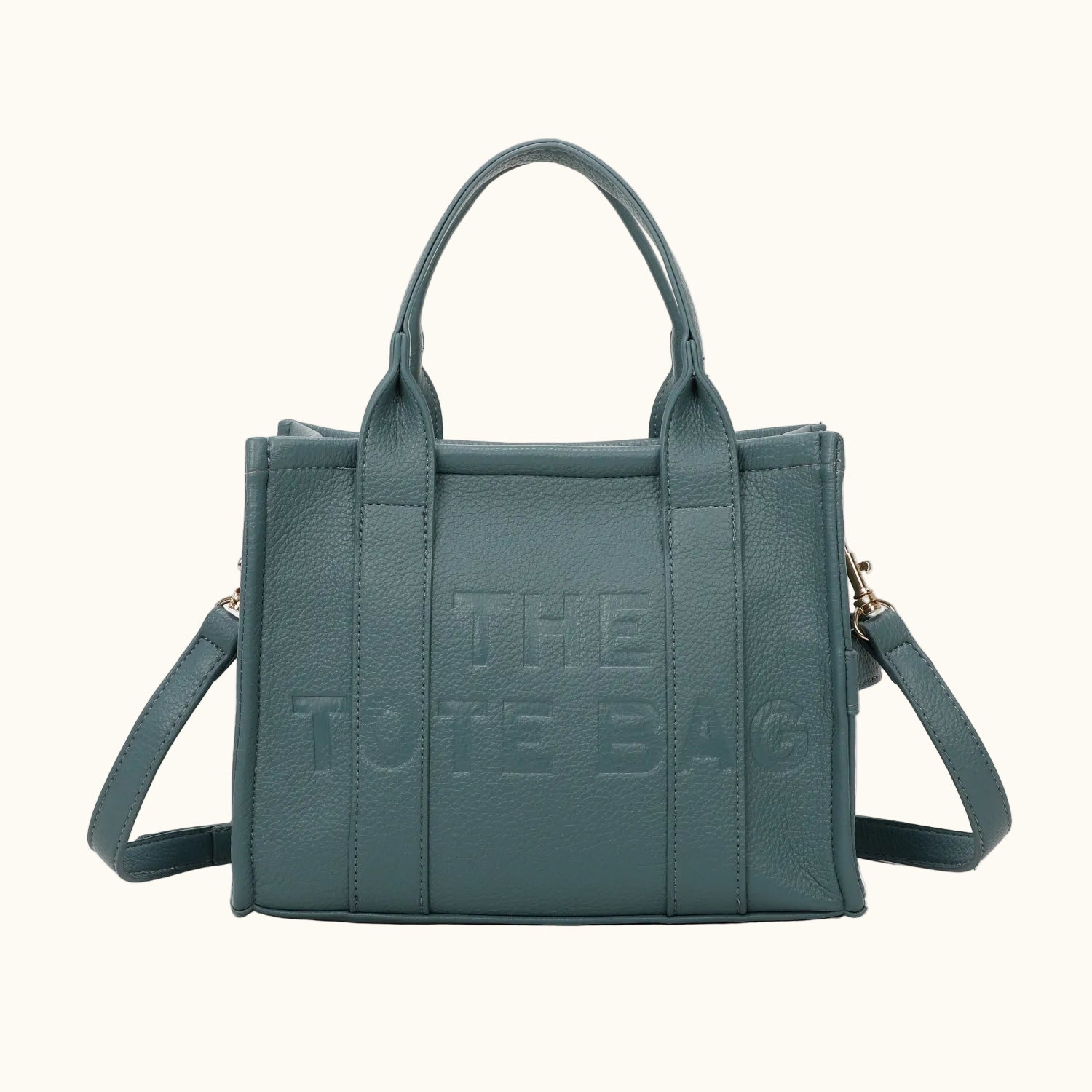 Teal tote bag with 'THE TOTE BAG' text on a white background