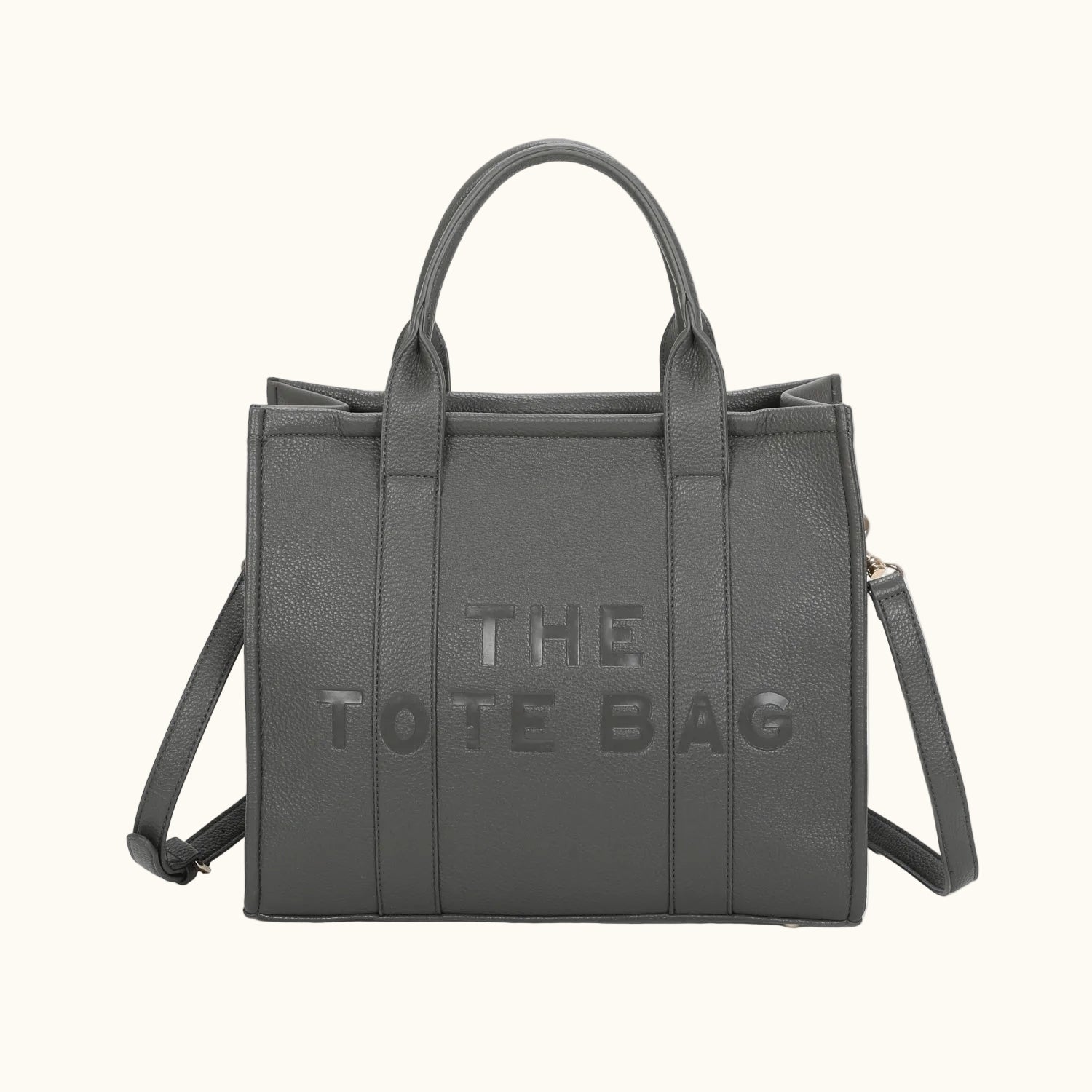 Gray tote bag with 'THE TOTE BAG' text on a white background