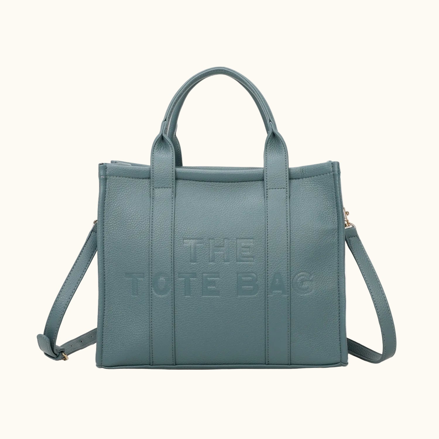 Blue tote bag with 'THE TOTE BAG' text on a white background