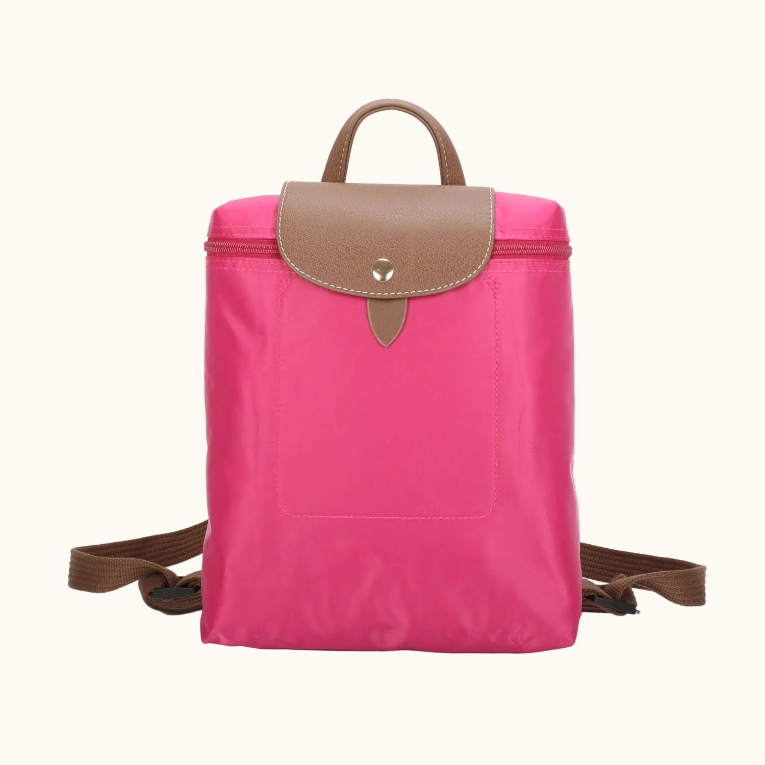 Pink backpack with brown accents on a white background