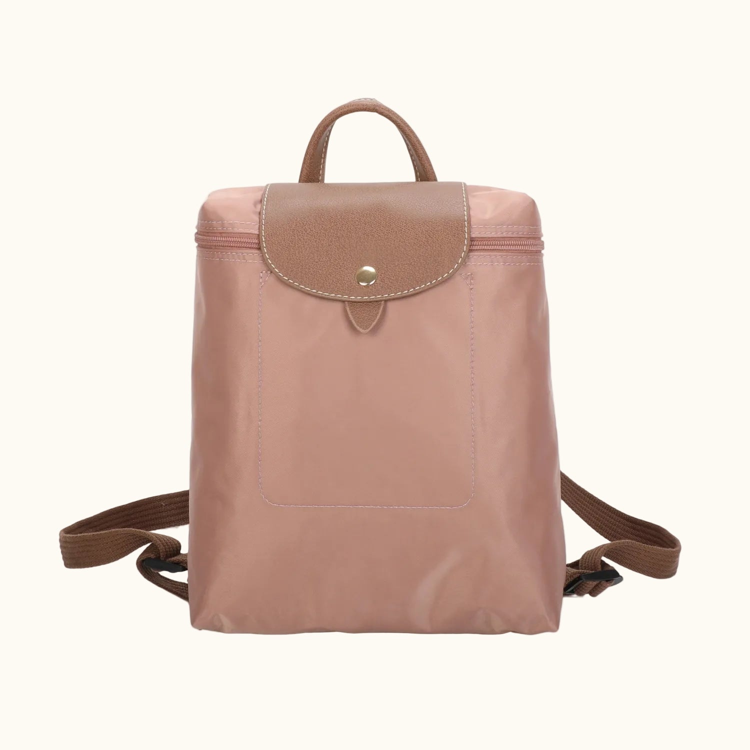 Pink backpack with brown leather accents on a white background