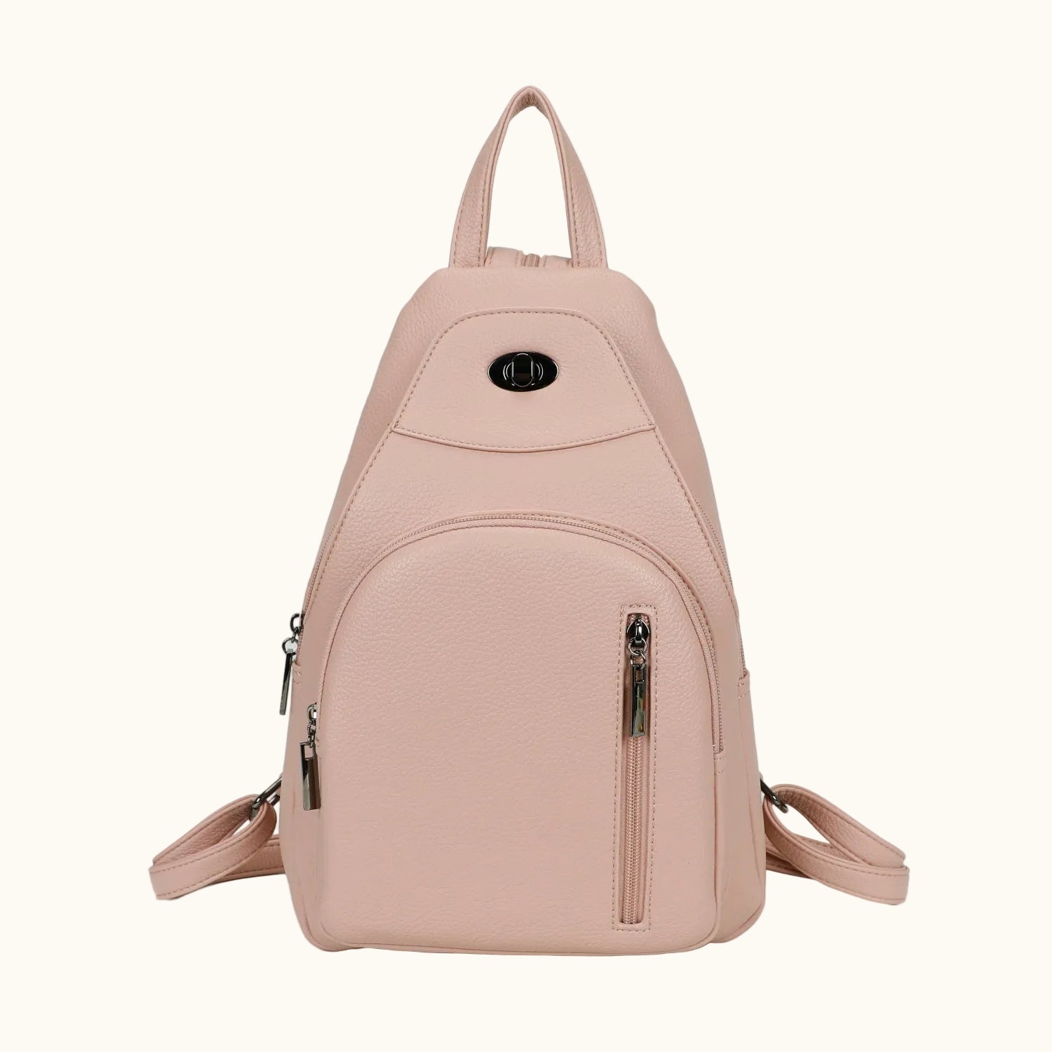 Pink backpack with zippers on a white background