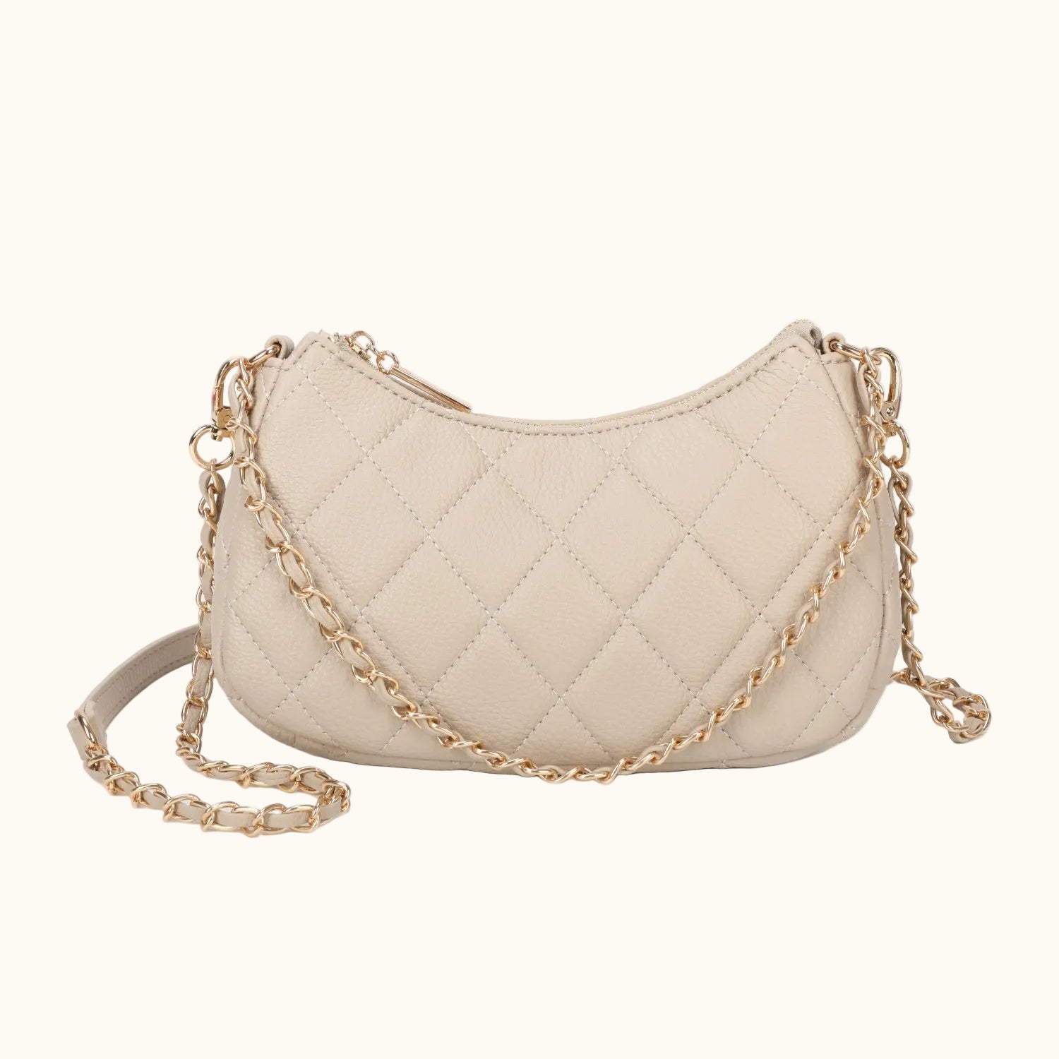 Beige quilted handbag with a gold chain on a white background