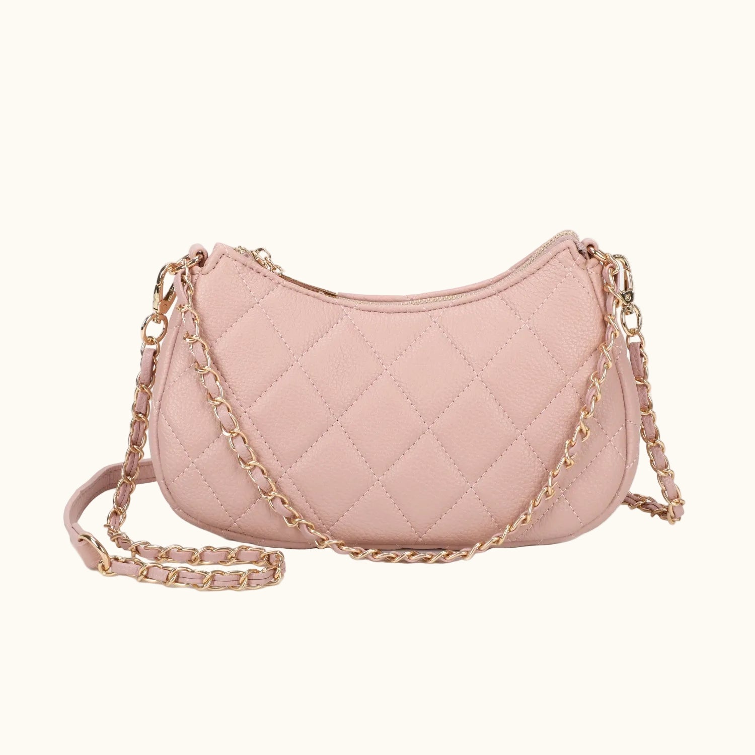 Pink quilted handbag with a gold chain strap on a white background