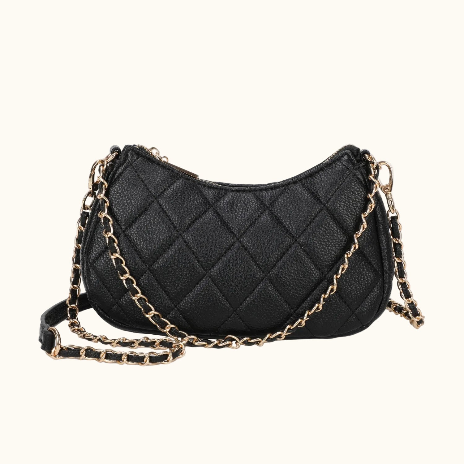 Black quilted handbag with a gold chain strap on a white background