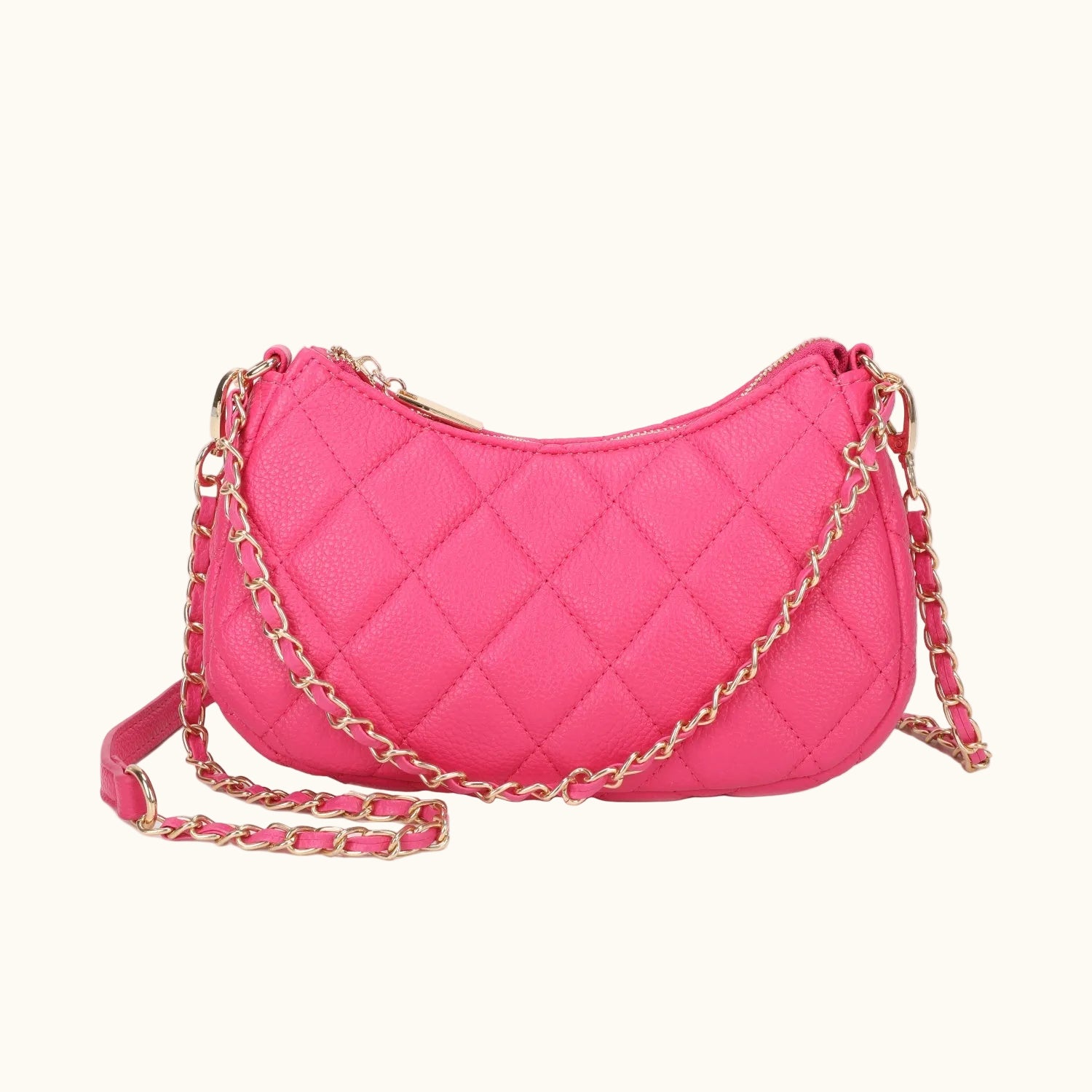 Pink quilted handbag with a gold chain strap on a white background
