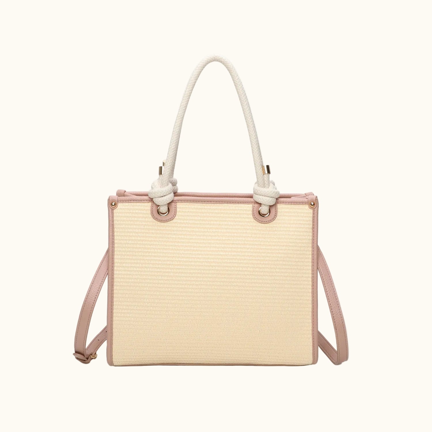 Handbag with beige woven body and pink accents on a white background
