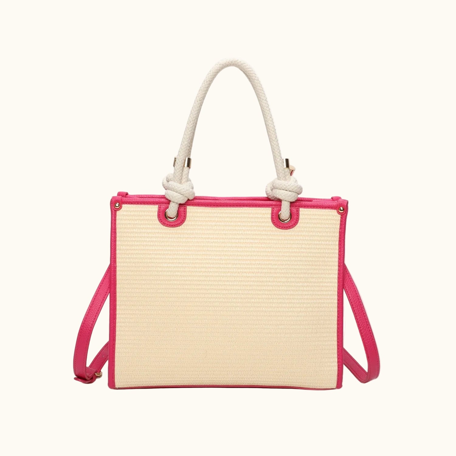 Handbag with pink frame and cream-colored top, featuring a rope handle on a white background.