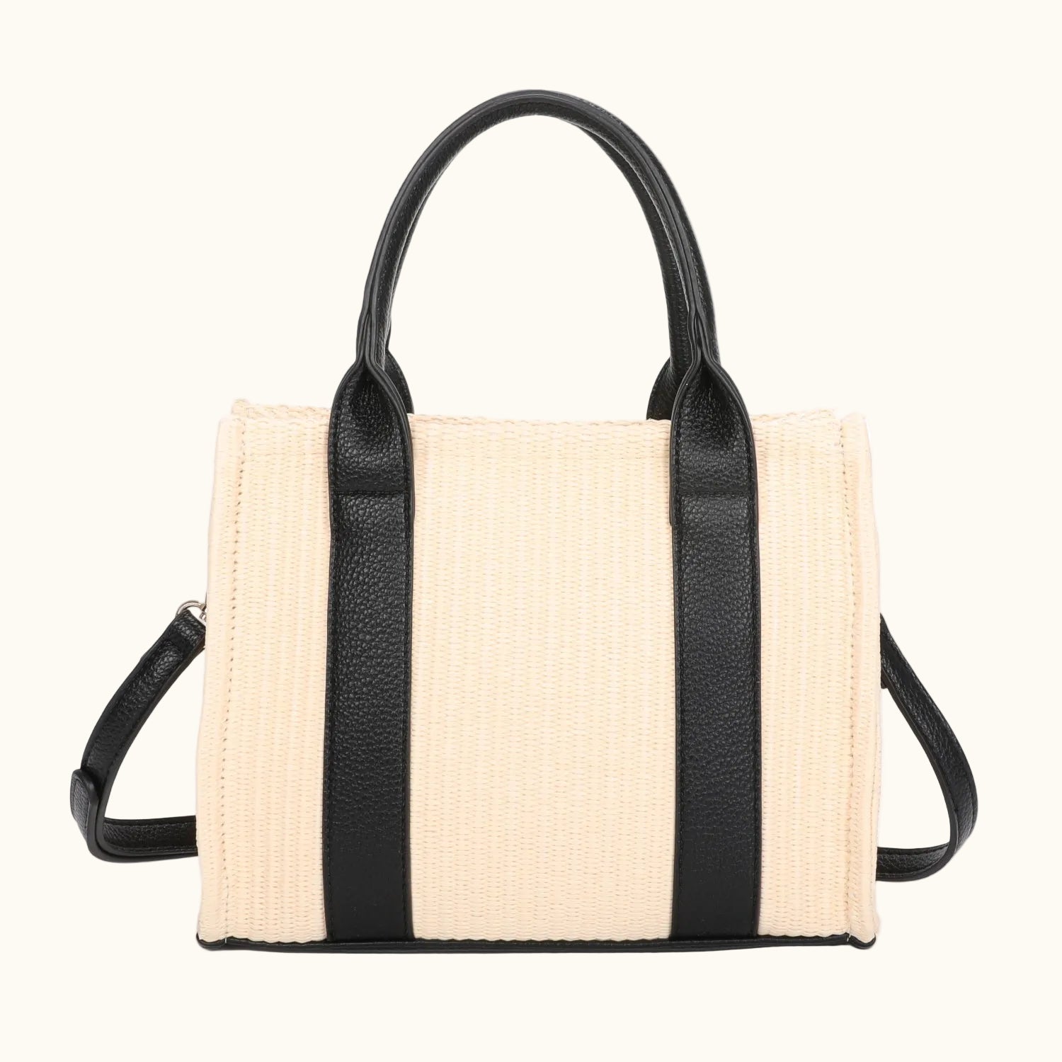 Beige handbag with black straps on a white background